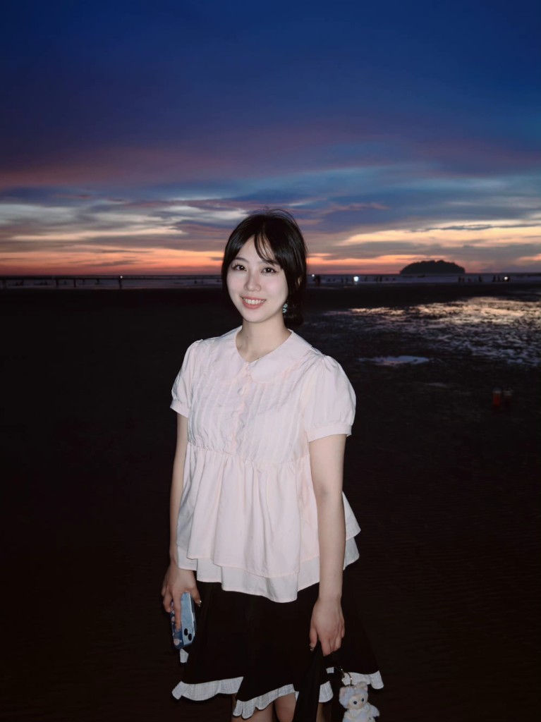 Shuyan Wang portrait at dusk seaside